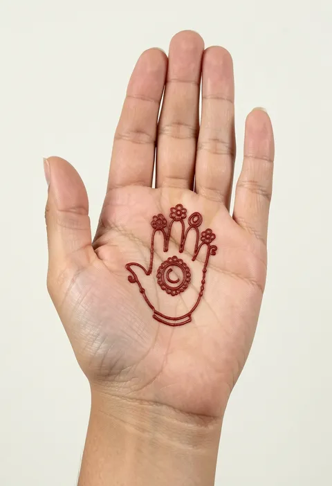 Simple for-kids front-hand mehndi design with a round medallion and little flower buds on the palm
