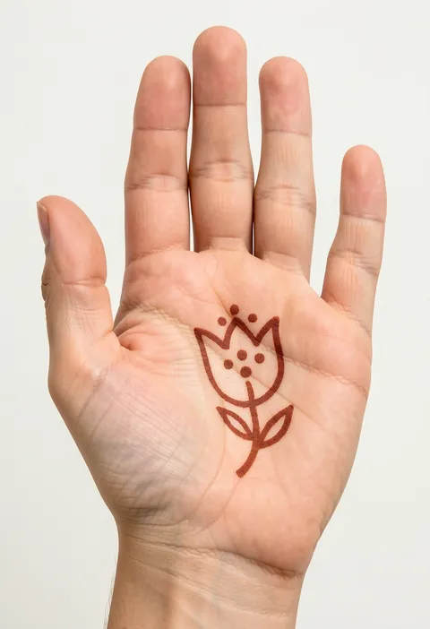 Kids front hand mehndi with a single outlined tulip, two leaves and playful dots in the centre of the palm